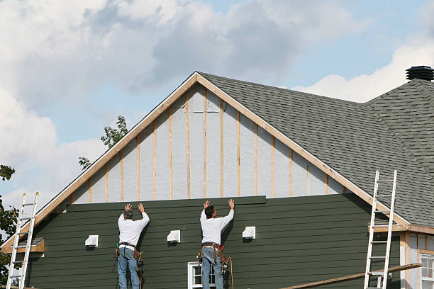 Professional Siding technician working in East Norwich, NY